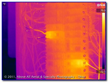 infrared image showing a couple of warm circuit breakers in an electrical panel