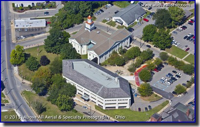 An aerial photograph of the Lawrence County (Pennsylvania) Courthouse, New Castle, PA, surrounded by flags for September 11.