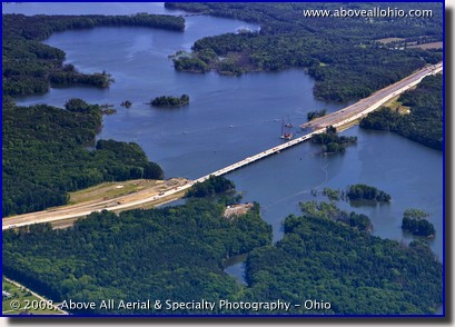 Aerial photograph of an interstate highway bridge under construction over water