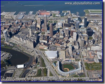 Progressive Field - formerly Jacobs Field - and downtown Cleveland Ohio. Cleveland Stadium is also visible in the background of this aerial photo.