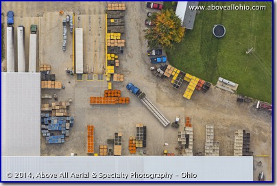 A nearly vertical overhead view of pumpkins, gourds, and  various squashes awaiting processing at a facility near North Fairfield, Ohio.